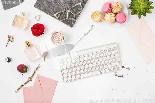 Image of Top view of white office female workspace with pc