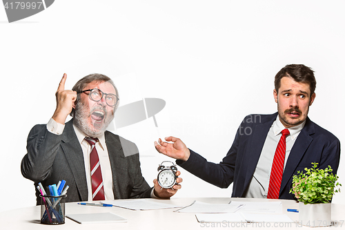 Image of The two colleagues working together at office on white background.