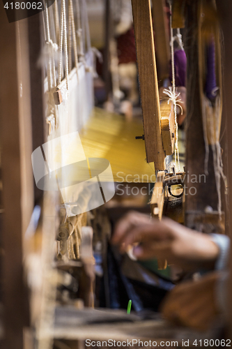 Image of woman Weaving