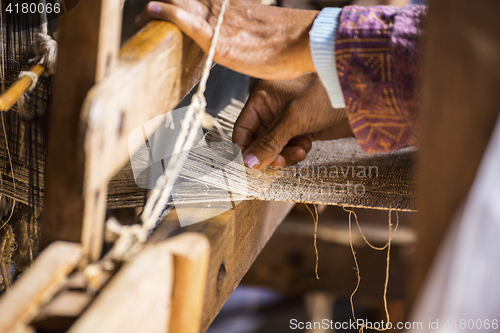 Image of woman Weaving