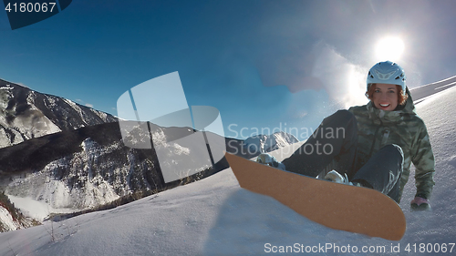 Image of snowboarding woman