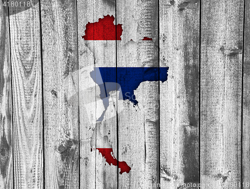 Image of Map and flag of Thailand on weathered wood