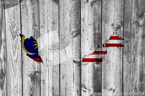 Image of Map and flag of Malaysia on weathered wood