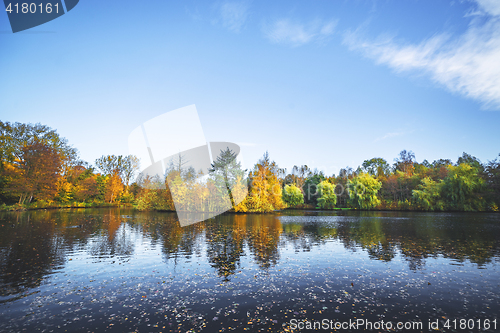 Image of Autumn landscape with a lake and trees