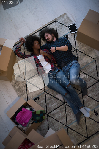 Image of Top view of attractive young multiethnic couple