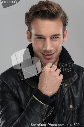 Image of portrait of a young guy over gray background