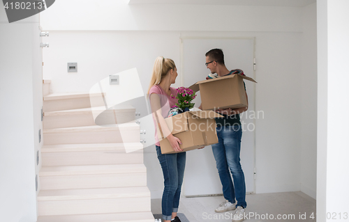 Image of young couple moving into a new home