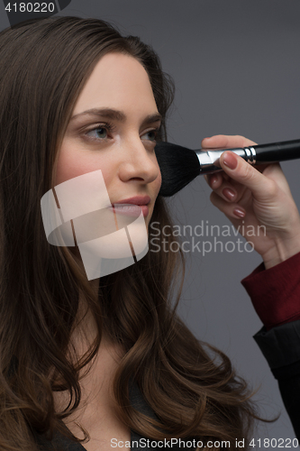 Image of professional makeup artist working