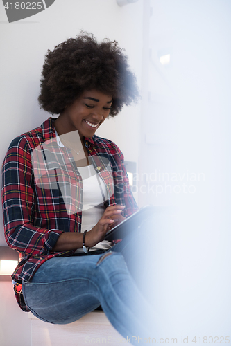 Image of black woman using her electronic tablet