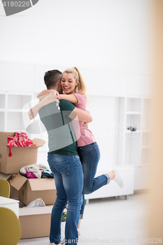 Image of happy Young couple moving in new house