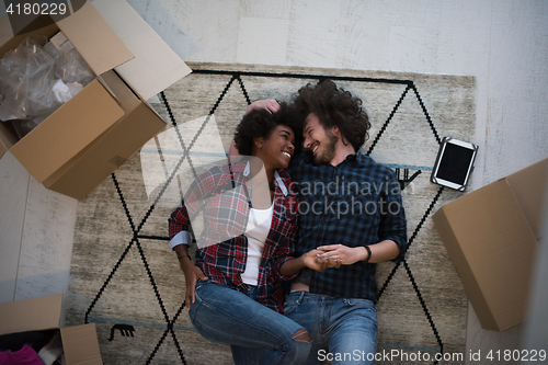 Image of Top view of attractive young multiethnic couple