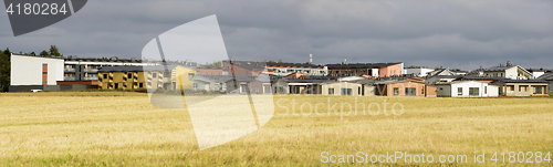 Image of urban area next to the field in autumn