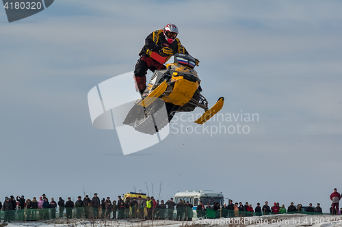 Image of High jump of sportsman on snowmobile