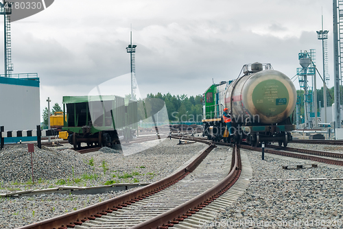 Image of Shunting locomotive transports tank on other way