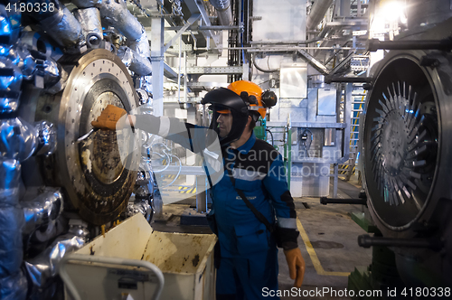 Image of Industrial mechanic cleaning extruder machine