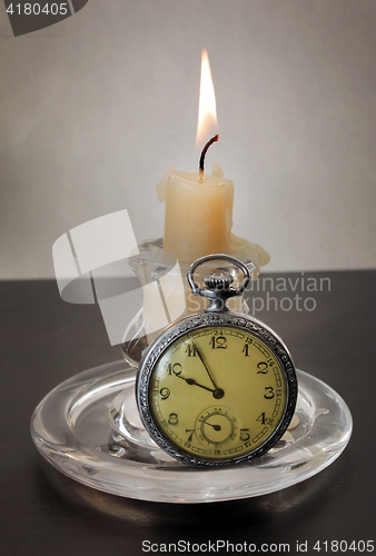 Image of Candlestick and Pocket Watch