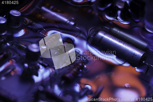 Image of vintage circuit board with dark red and blue reflection