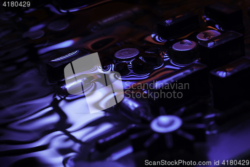 Image of vintage circuit board with blue and red reflection