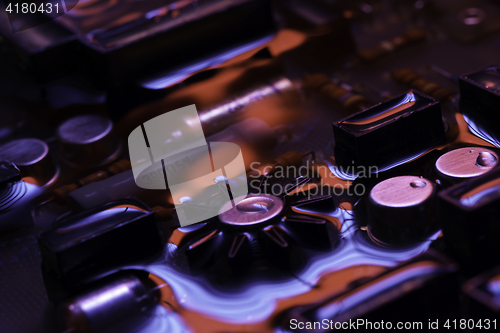 Image of vintage circuit board with red and blue reflection