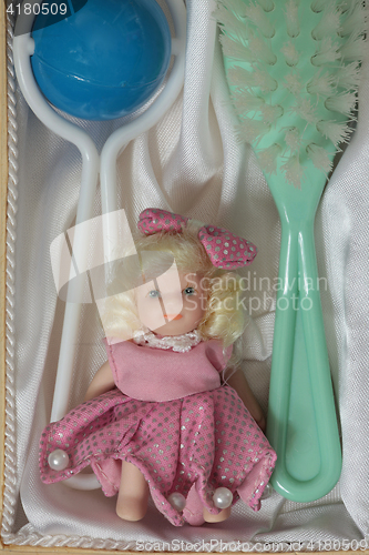 Image of  Doll brush rattle close to