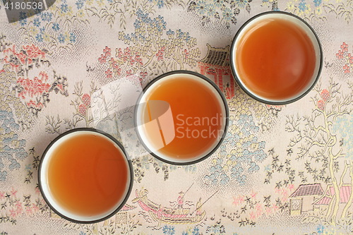 Image of  tea Ceremony three cups cup tea macro shot