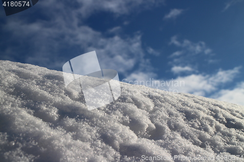 Image of  snow-white  against clear blue sky