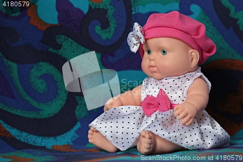 Image of puppet polka dot dress sitting