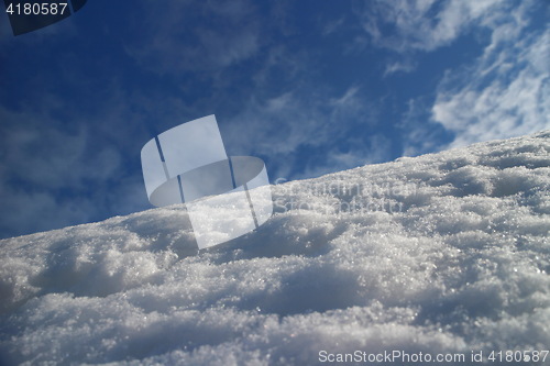 Image of  hard road to the top view of the snow-covered slope of Mount