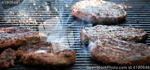 Image of Burgers on grill.