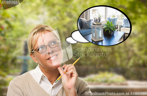 Image of Thoughtful Young Woman with Pencil and New Living Room in Though