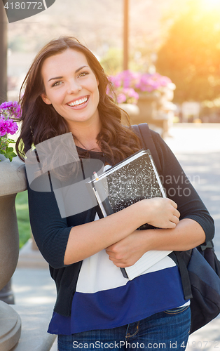 Image of Portrait of Pretty Young Female Student Carrying Books on School