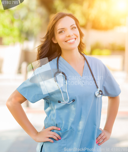 Image of Portrait of Young Adult Female Doctor or Nurse Wearing Scrubs an