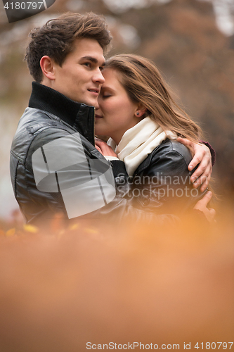 Image of Autumn portrait of attractive happy couple