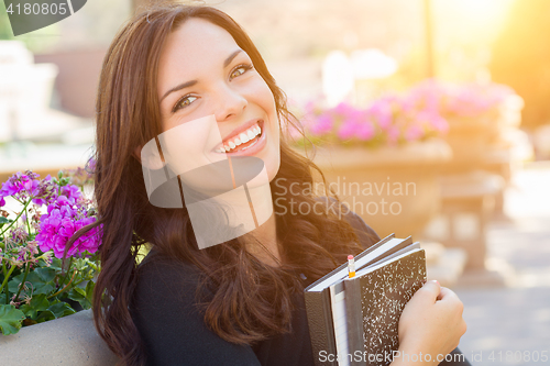 Image of Portrait of Pretty Young Female Student Carrying Books on School