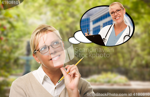 Image of Thoughtful Young Woman with Pencil and Herself As Nurse or Docto