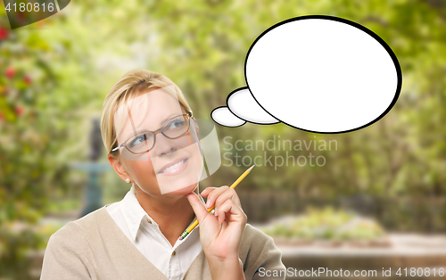 Image of Thoughtful Young Woman with Pencil and Blank Thought Bubble.