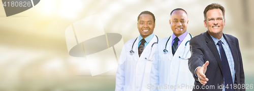 Image of Caucasian Businessman and African American Male Doctors, Nurses 