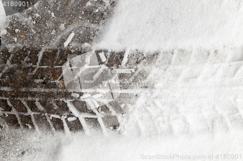 Image of traces of the car on snow