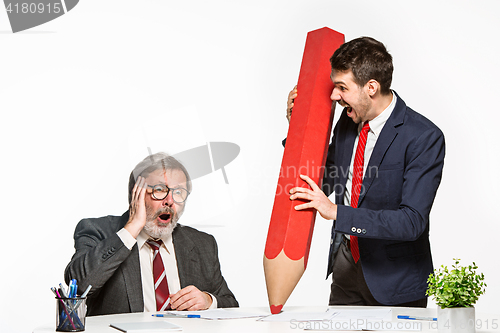 Image of The two colleagues working together at office on white background.