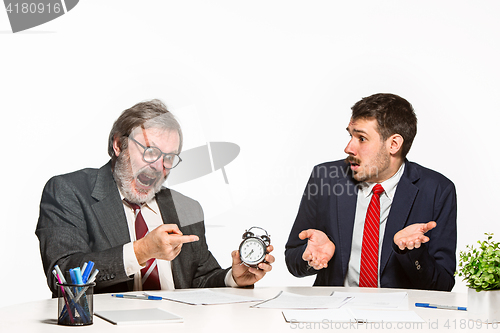 Image of The two colleagues working together at office on white background.