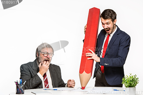 Image of The two colleagues working together at office on white background.