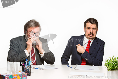 Image of The two colleagues working together at office on white background.