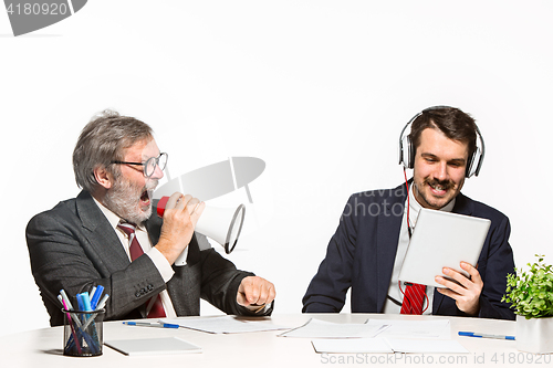 Image of The two colleagues working together at office on white background.