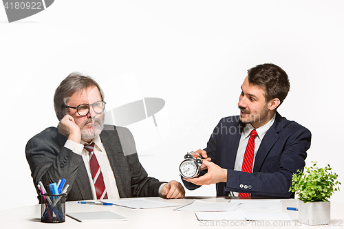 Image of The two colleagues working together at office on white background.