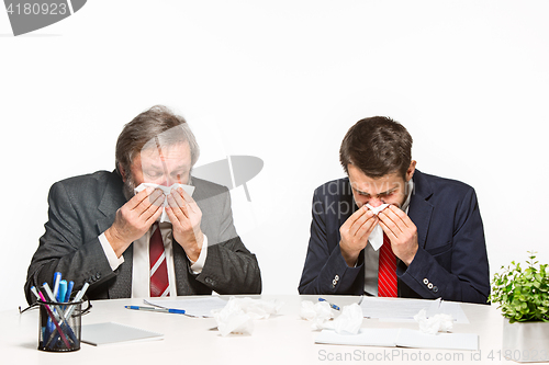 Image of The two colleagues working together at office on white background.