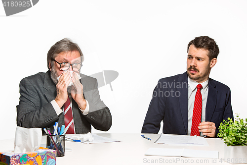 Image of The two colleagues working together at office on white background.