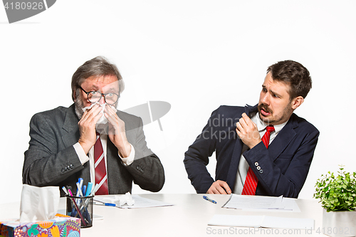 Image of The two colleagues working together at office on white background.