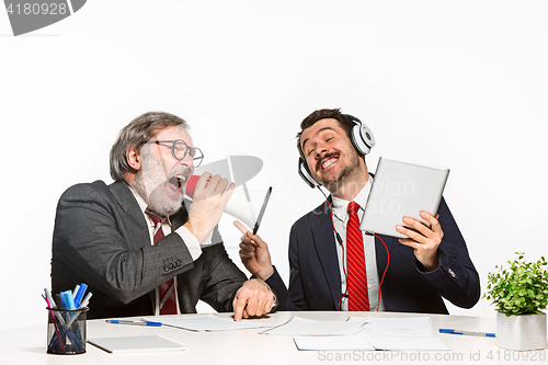 Image of The two colleagues working together at office on white background.