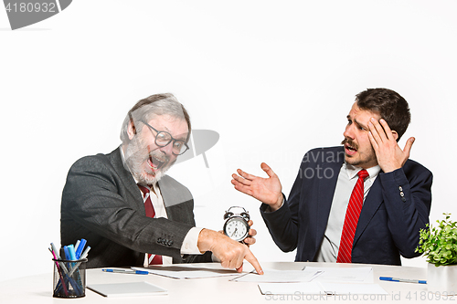 Image of The two colleagues working together at office on white background.