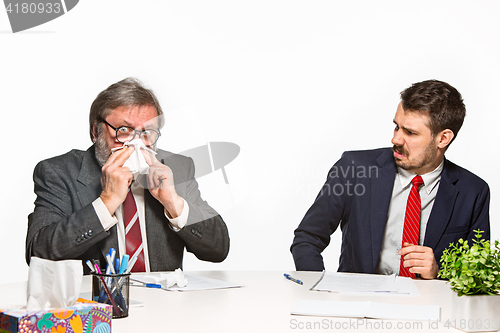 Image of The two colleagues working together at office on white background.